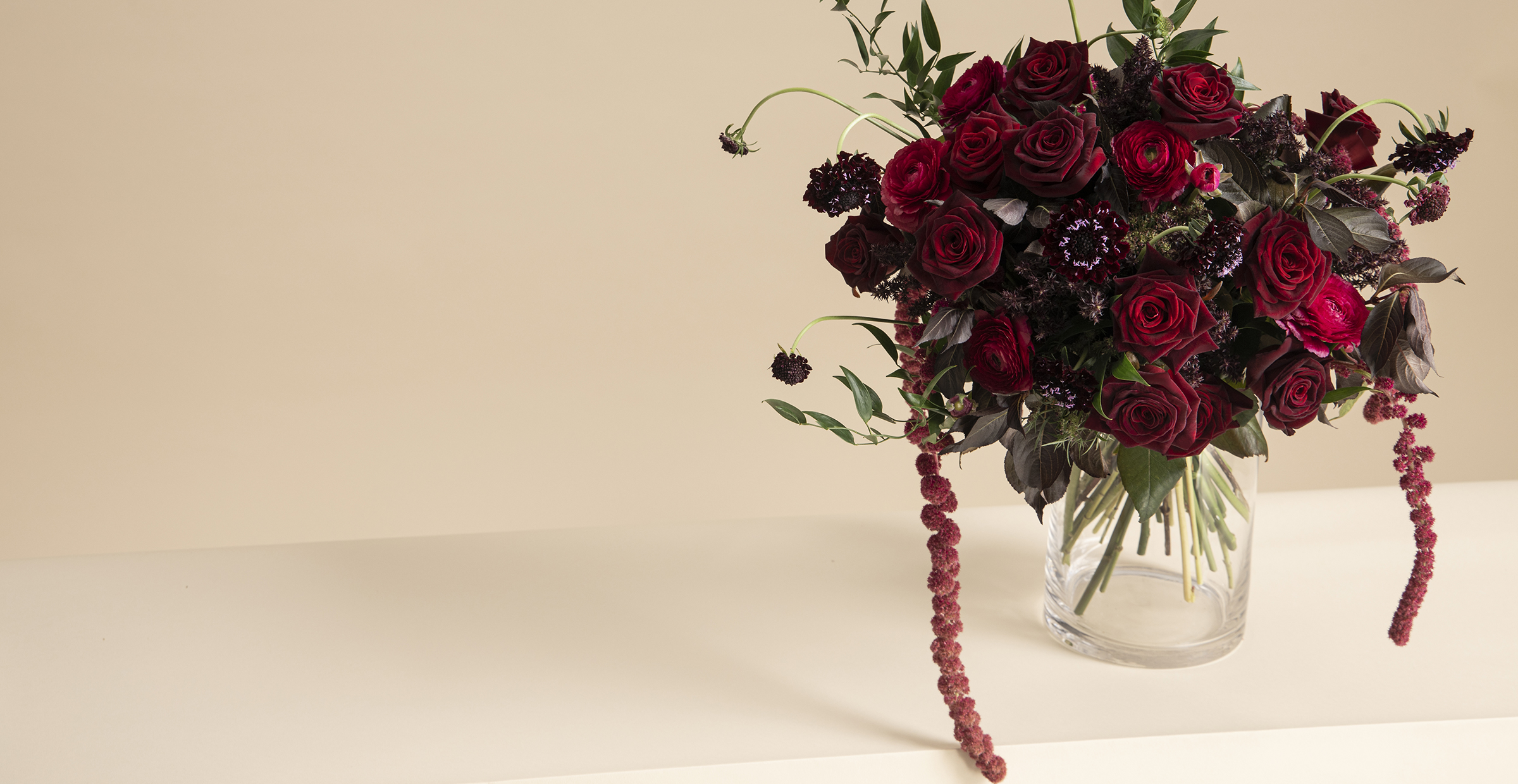 Banner image of Rose Noir flower bouquet of Carnation and Ranunculus for the online flower collection